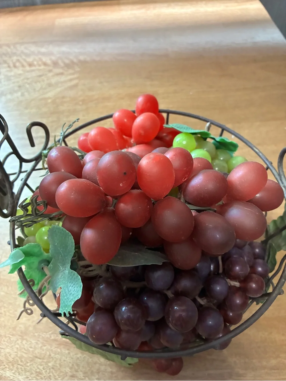 decorative artificial grape clusters, in a wire basket 8” x 10”